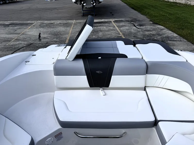 Slide: The Image of 2025 Chaparral 23 SSi boat interior with sleek, modern seating design. - 14