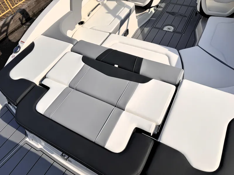 Slide: The Image of 2025 Chaparral 23 SSi boat interior with sleek, modern seating design. - 24