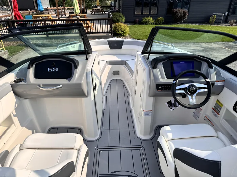 Slide: The Image of 2025 Chaparral 23 SSi boat interior with modern dashboard and seating. - 7