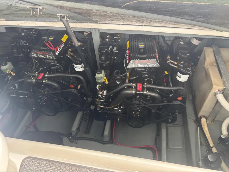 Slide: The Image of Twin engines in a 1996 Sea Ray 330 Sundancer boat engine compartment. - 18