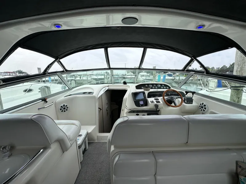 Slide: The Image of Interior view of 1996 Sea Ray 330 Sundancer yacht cockpit with modern controls. - 4