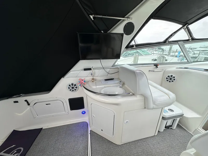 Slide: The Image of Interior of 1996 Sea Ray 330 Sundancer yacht with seating and entertainment system. - 5