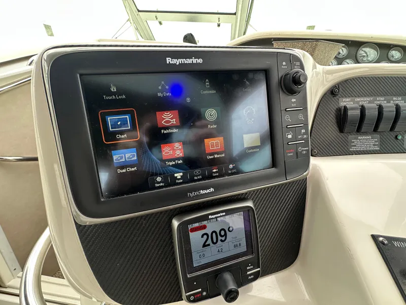Slide: The Image of Raymarine navigation system on 1996 Sea Ray 330 Sundancer boat dashboard. - 9
