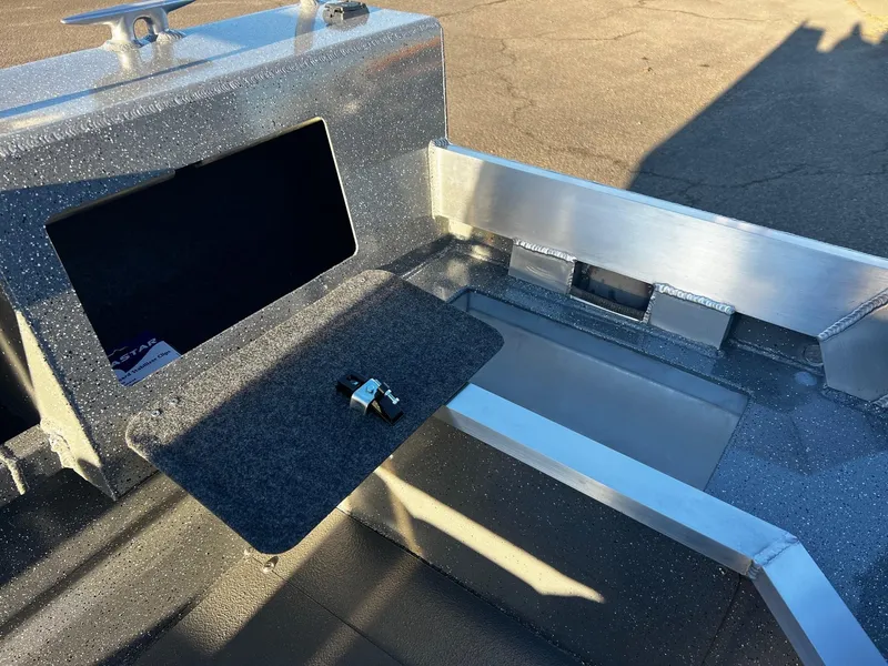 Slide: The Image of 2025 Thunder Jet 209 Rush OT boat interior with storage compartment and latch. - 12