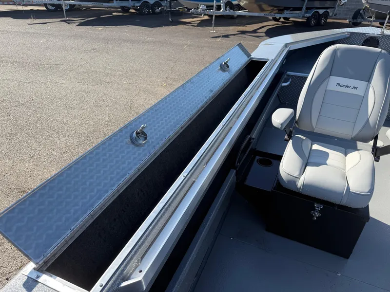 Slide: The Image of 2025 Thunder Jet 209 Rush OT boat interior with storage and seating. - 17