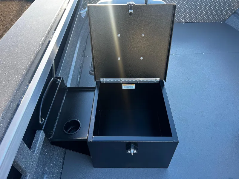Slide: The Image of Open storage compartment in 2025 Thunder Jet 209 Rush OT boat. - 18