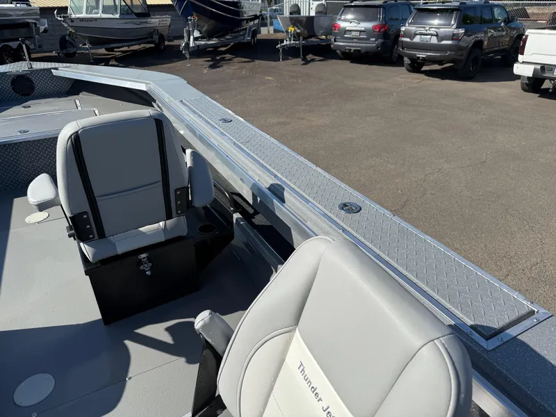 Slide: The Image of 2025 Thunder Jet 209 Rush OT boat interior with seating and storage. - 19