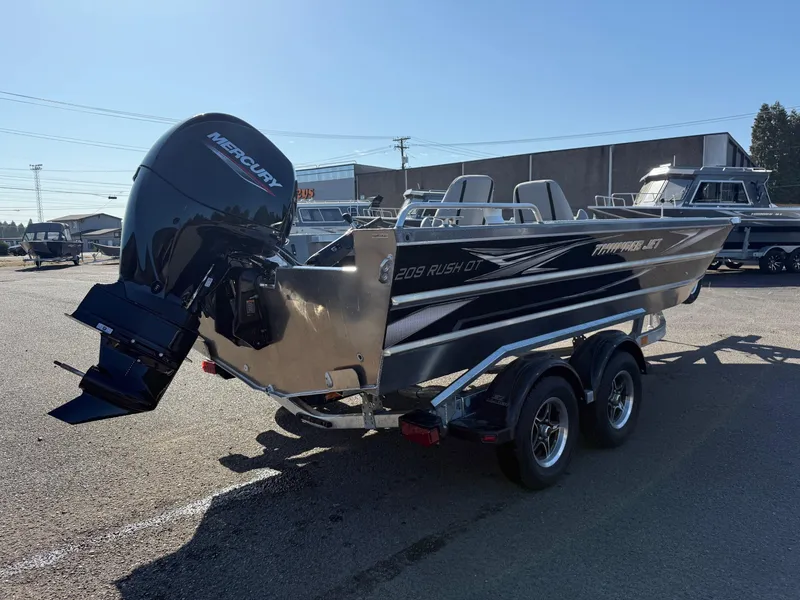 Slide: The Image of 2025 Thunder Jet 209 Rush OT boat with Mercury outboard motor on trailer. - 3