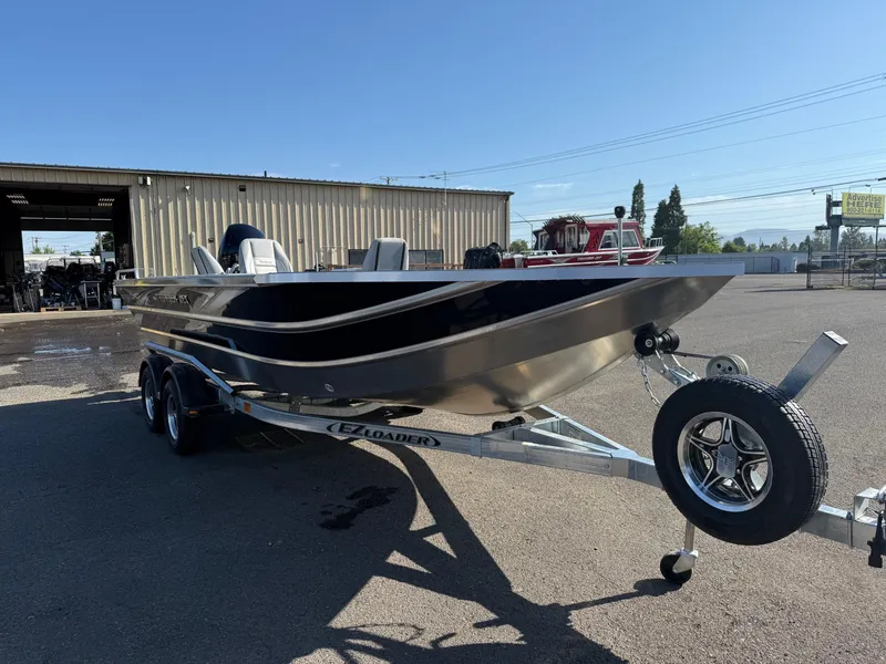 Slide: The Image of 2025 Thunder Jet 209 Rush OT boat on trailer in outdoor setting. - 5