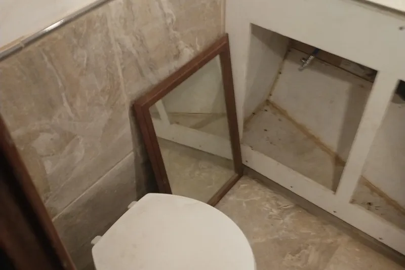 Slide: The Image of Bathroom interior of 1982 Hatteras 61 Motor Yacht with mirror and cabinet. - 10