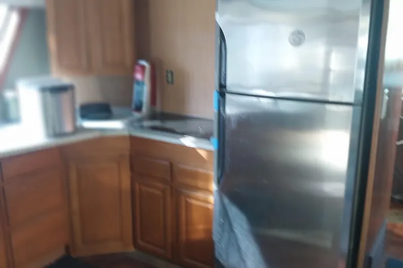 Slide: The Image of Interior kitchen of 1982 Hatteras 61 Motor Yacht with stainless steel appliances. - 19