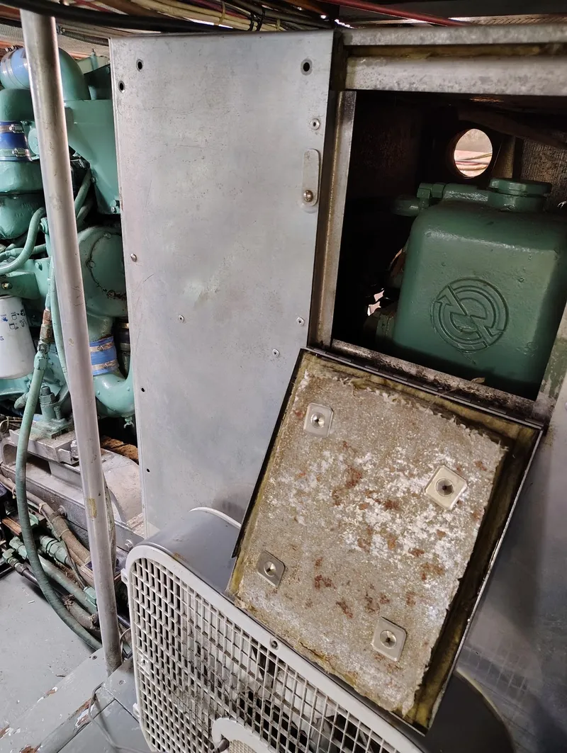 Slide: The Image of Engine room of 1982 Hatteras 61 Motor Yacht with visible machinery and components. - 22