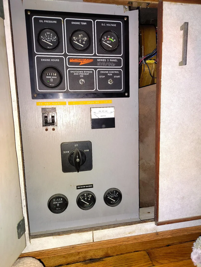 Slide: The Image of Control panel of a 1982 Hatteras 61 Motor Yacht, featuring gauges and switches. - 30