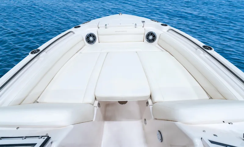 Slide: The Image of 2026 Grady-White 215 Freedom boat interior with white seating and ocean backdrop. - 15