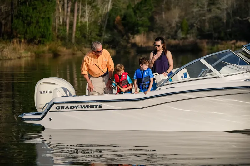 Slide: The Image of Family enjoying a day on a 2026 Grady-White 215 Freedom boat. - 8
