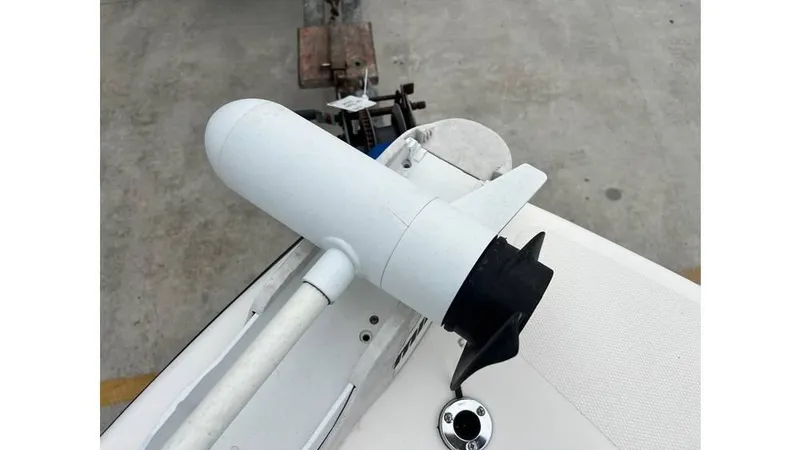 Slide: The Image of Close-up of a 2001 Skeeter 2200 ZX boat component on a concrete surface. - 11