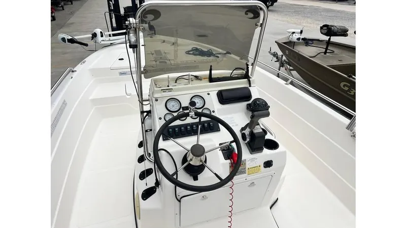 Slide: The Image of 2001 Skeeter 2200 ZX boat console with steering wheel and controls. - 14