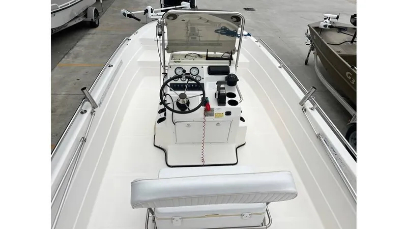 Slide: The Image of 2001 Skeeter 2200 ZX boat interior with steering console and seating. - 4