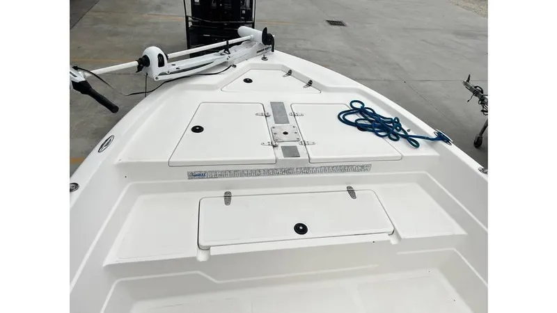 Slide: The Image of 2001 Skeeter 2200 ZX boat deck with storage compartments and blue rope. - 8