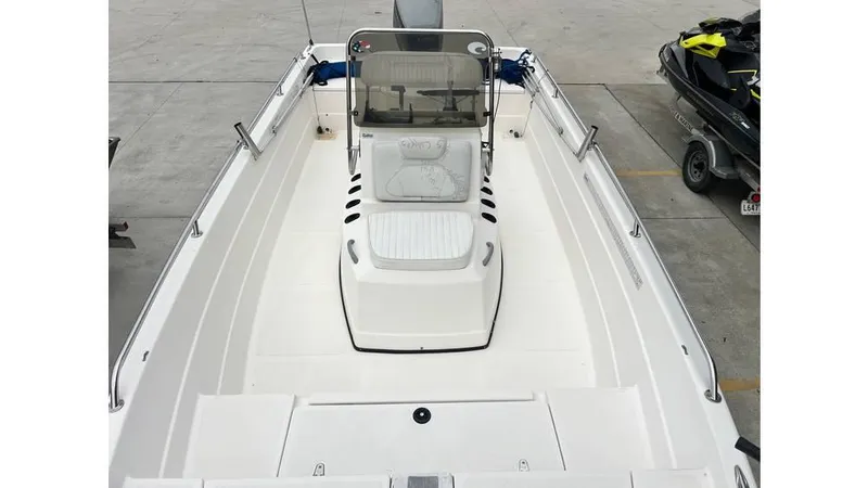 Slide: The Image of 2001 Skeeter 2200 ZX boat interior, featuring a spacious deck and central console. - 9