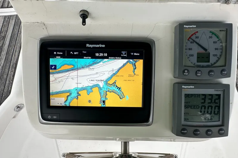 Slide: The Image of Raymarine navigation system on 2004 Beneteau 393, displaying Lake Texoma map and instrument readings. - 19