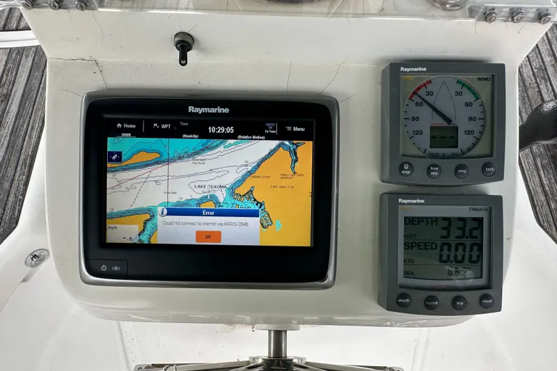 Slide: The Image of Beneteau 393 2004 yacht navigation system with Raymarine displays showing map and data. - 20