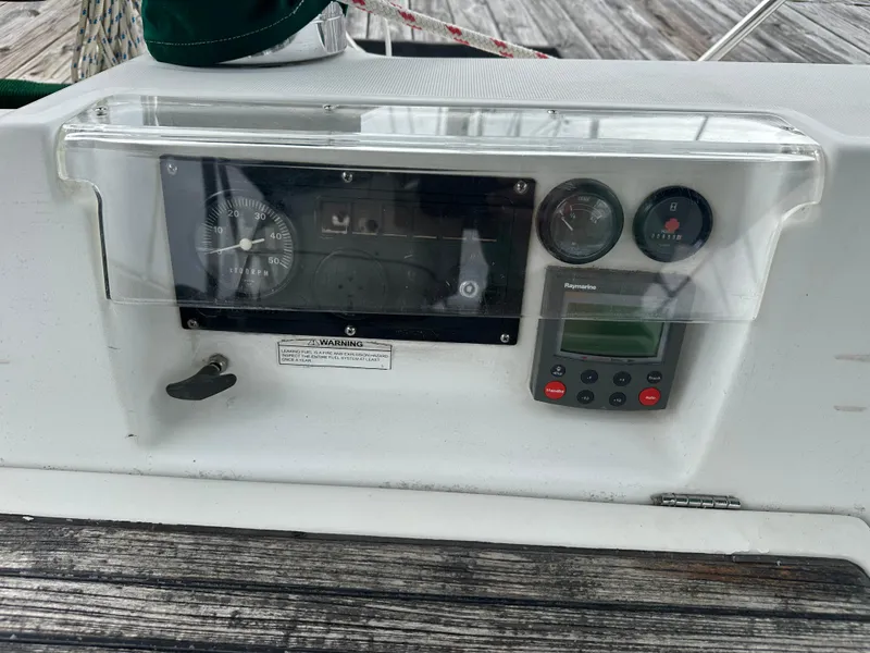 Slide: The Image of Control panel of a 2004 Beneteau 393 sailboat with gauges and navigation equipment. - 22