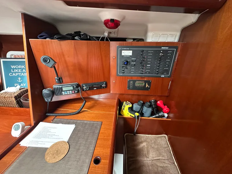 Slide: The Image of Interior of 2004 Beneteau 393 sailboat with navigation equipment and control panel. - 41