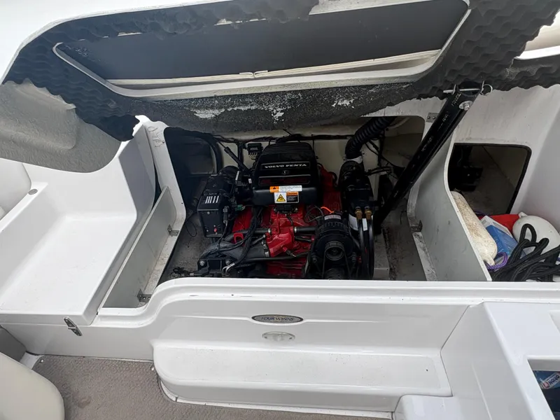Slide: The Image of Engine compartment of a 2002 Four Winns 260 Horizon boat, featuring a Volvo Penta engine. - 15