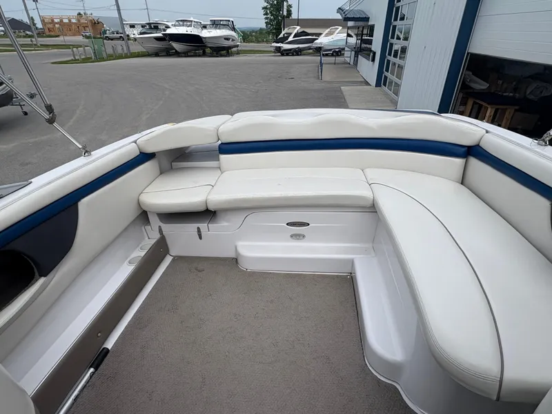 Slide: The Image of 2002 Four Winns 260 Horizon boat interior with white and blue seating. - 8