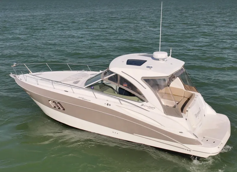 Slide: The Image of 2009 Cruisers Yachts 360 Express on open water, showcasing sleek design and luxury features. - 10