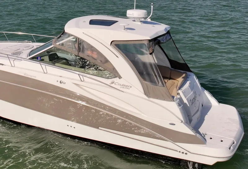 Slide: The Image of 2009 Cruisers Yachts 360 Express on water, side view, sleek design. - 12