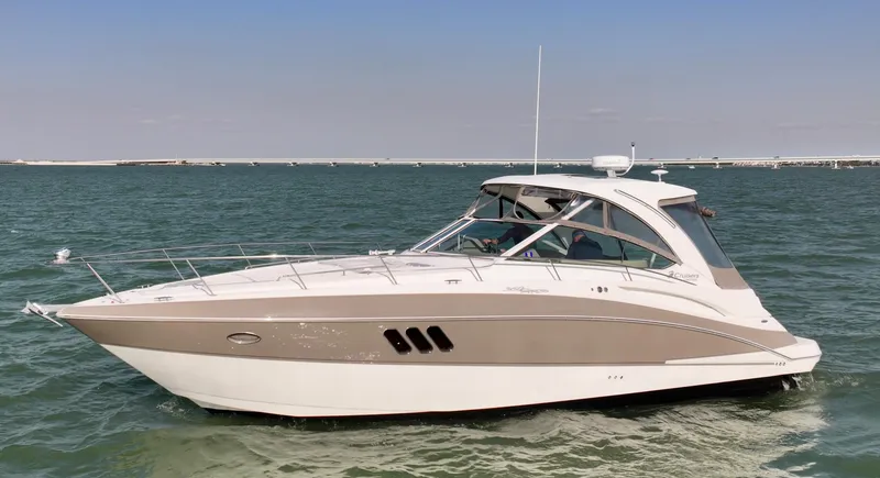 Slide: The Image of 2009 Cruisers Yachts 360 Express on calm water, showcasing sleek design and modern features. - 14