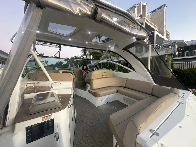 Slide: The Image of 2009 Cruisers Yachts 360 Express interior with beige seating and modern design. - 24