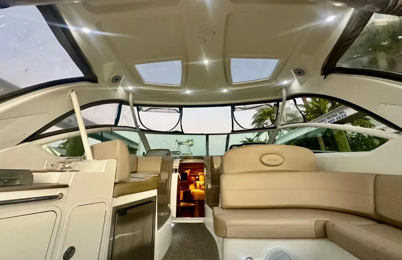 Slide: The Image of 2009 Cruisers Yachts 360 Express interior with beige seating and modern design. - 25