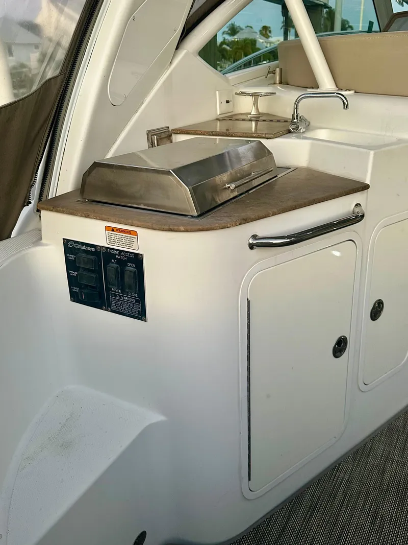 Slide: The Image of 2009 Cruisers Yachts 360 Express boat interior with kitchenette and grill. - 26