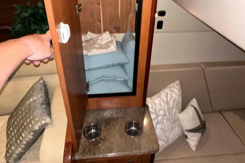 Slide: The Image of 2009 Cruisers Yachts 360 Express interior with cushions, cabinet, and countertop. - 43