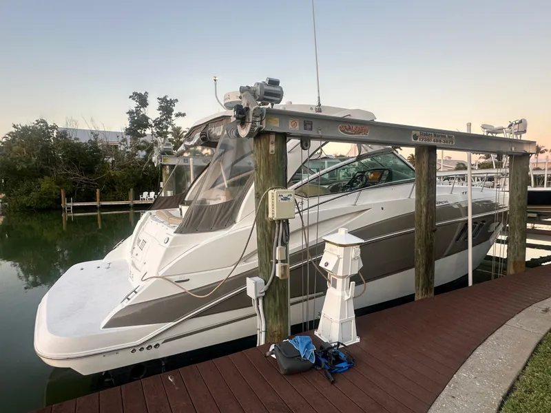 Slide: The Image of 2009 Cruisers Yachts 360 Express docked at marina, side view. - 19