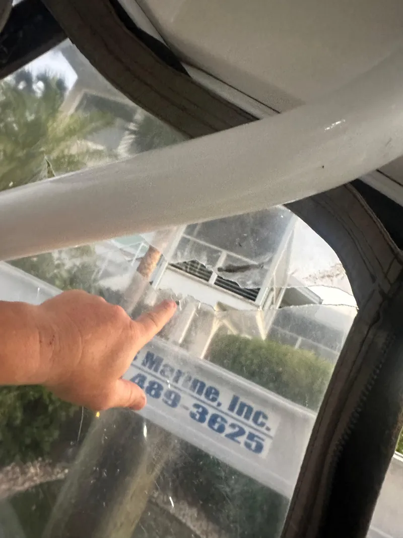 Slide: The Image of Hand pointing inside 2009 Cruisers Yachts 360 Express, with a view of a marine service sign. - 32