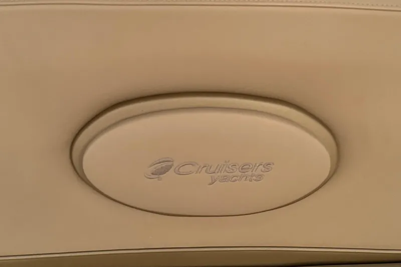 Slide: The Image of Cruisers Yachts 360 Express 2009 logo on beige interior panel. - 35