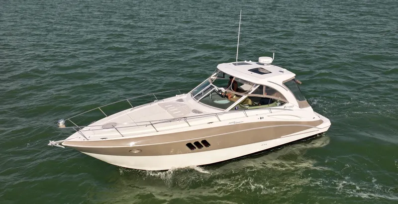 Slide: The Image of 2009 Cruisers Yachts 360 Express navigating on open water. - 4