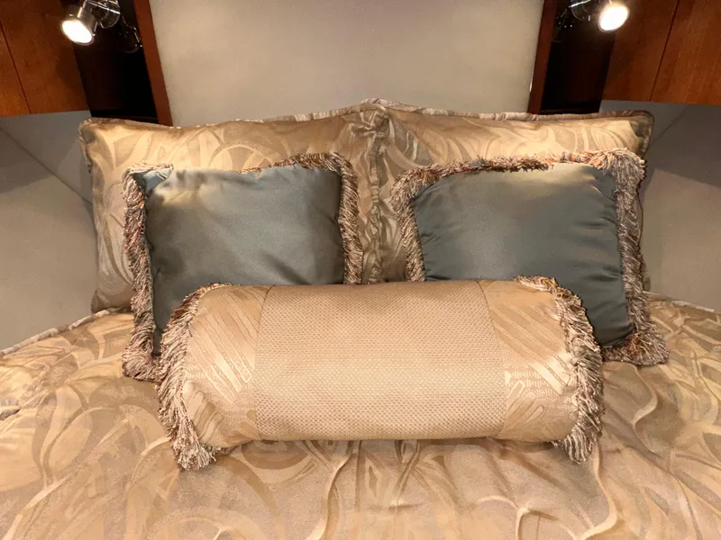 Slide: The Image of Luxurious bedding in 2009 Cruisers Yachts 360 Express cabin, featuring elegant pillows and lighting. - 41