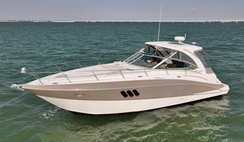 Slide: The Image of 2009 Cruisers Yachts 360 Express on open water, sleek design, luxury boating experience. - 5