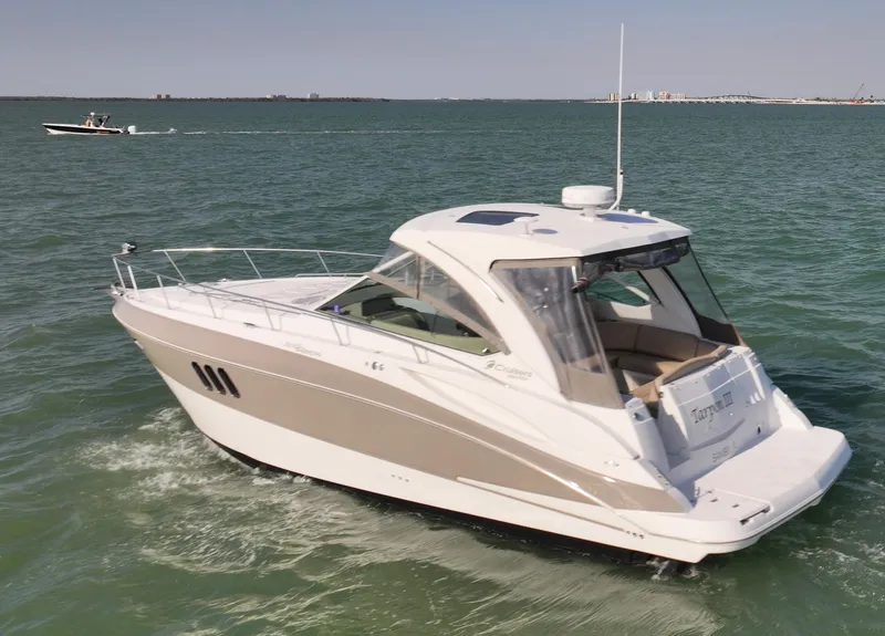 Slide: The Image of 2009 Cruisers Yachts 360 Express on open water, showcasing sleek design and luxury features. - 7