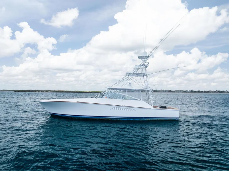 Slide: The Image of 2010 Viking 52 Open yacht on calm ocean under cloudy sky. - 15