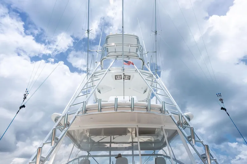 Slide: The Image of Viking 52 Open yacht, 2010 model, viewed from below against a cloudy sky. - 18
