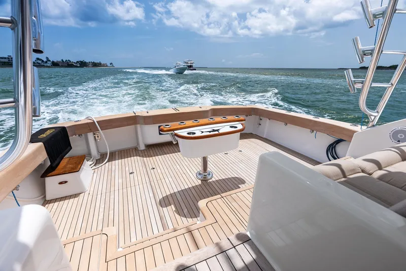 Slide: The Image of 2010 Viking 52 Open yacht deck with ocean view and fishing chair. - 21