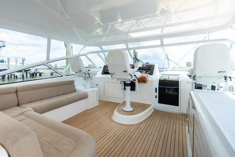 Slide: The Image of Luxurious interior of 2010 Viking 52 Open yacht with modern seating and helm. - 32