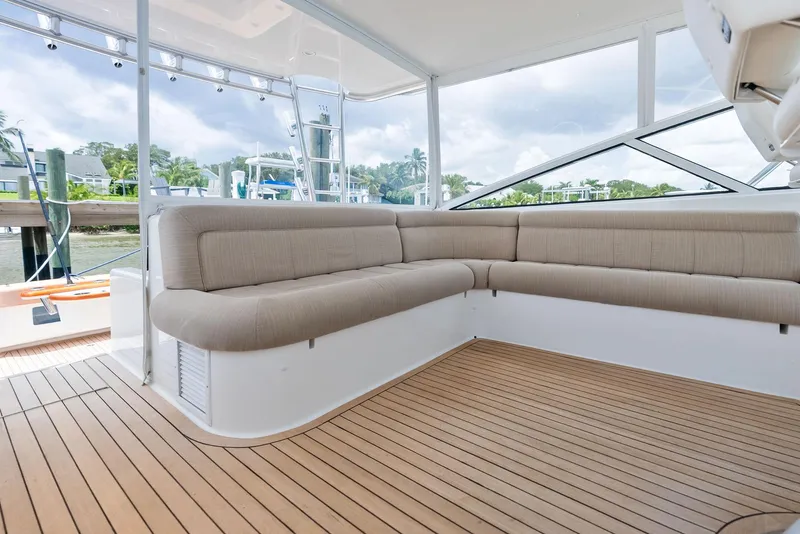 Slide: The Image of 2010 Viking 52 Open yacht with spacious deck seating and sleek design. - 33