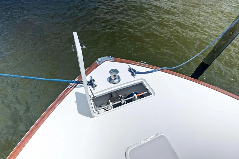 Slide: The Image of Bow of 2010 Viking 52 Open yacht with anchor compartment and mooring lines. - 38